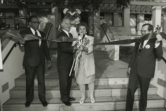 Jack Samuelson '46 and wife Sally (Reid) Samuelson '48 cut the ribbon to open Samuelson Pavilion in April 1994 as President Slaughter looks on.