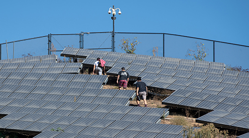 Students in Assistant Professor Aleem Hossain’s 360 video class gather footage using 360-degree video cameras at the solar array on Fiji Hill on Oct. 21, 2019.