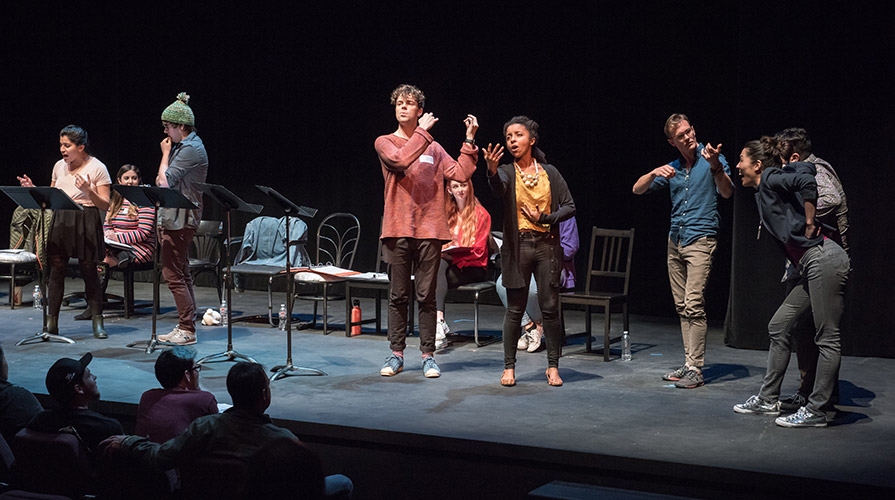 Students perform on stage at the New Play Festival