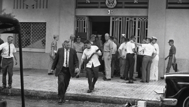 Deputy Ambassador U. Alexis Johnson ’31, left, evacuates the U.S. Embassy in Saigon on March 31, 1965.