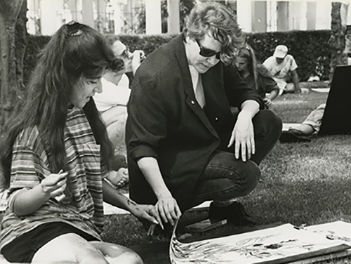 Besemer reviews a student’s work during an art class on the front lawn of Weingart in April 1992. 