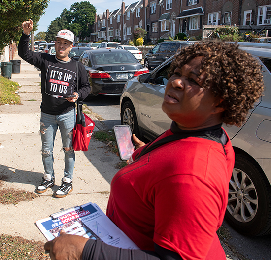 Wernel Martinez, left, a canvasser for UNITE HERE Philadelphia, moved to Orlando, Fla., from Puerto Rico, where he grew up.