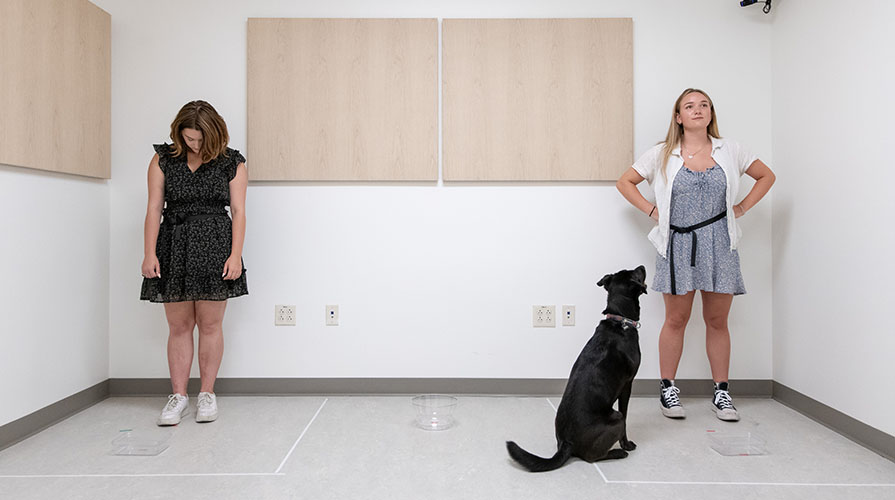 Two Occidental College students conducting social research with a dog