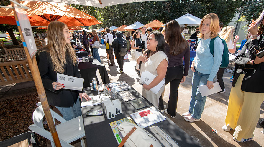 students talking to employers at the Occidental College Career Fair on the Quad