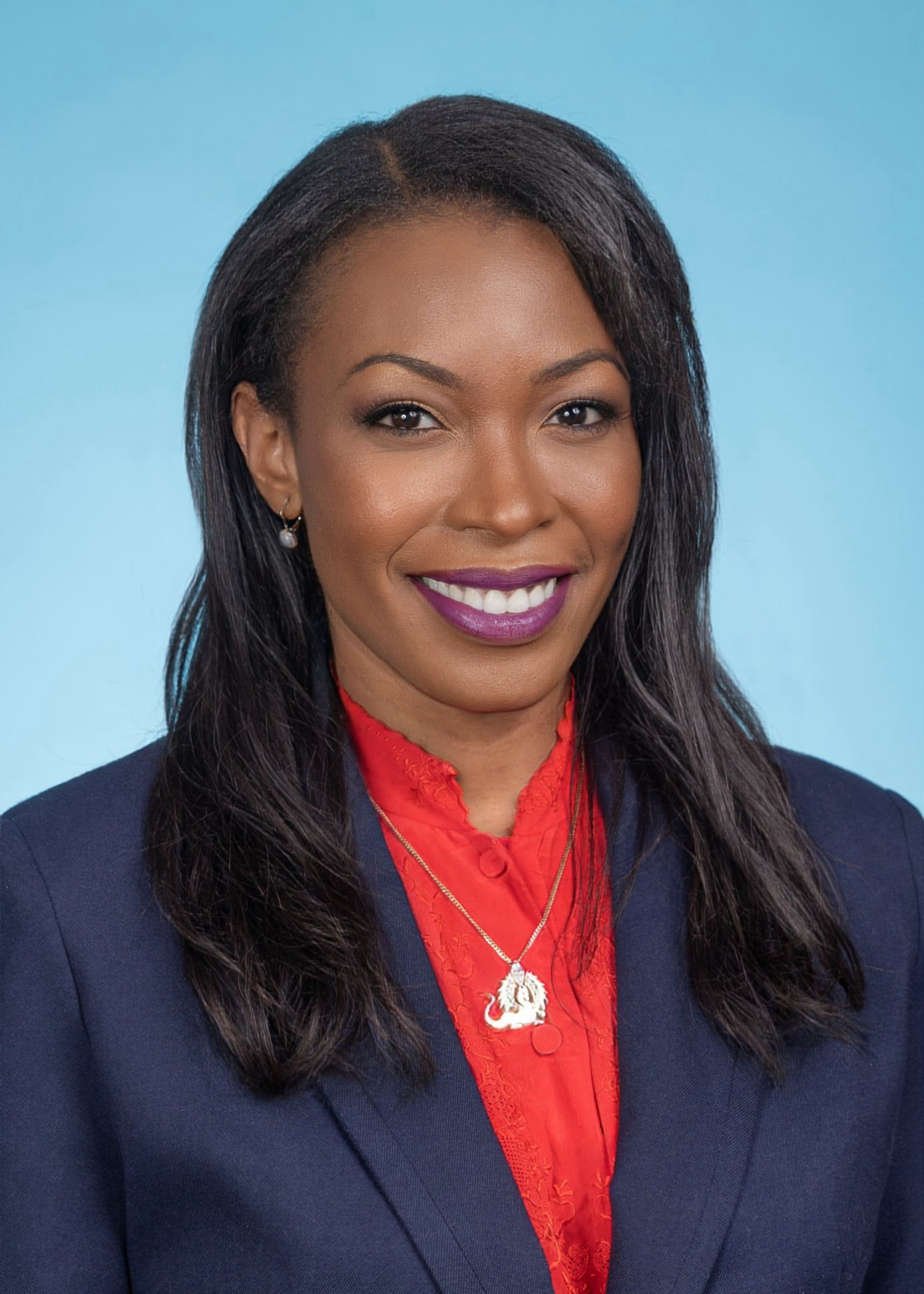 Dr. Lamar Thomas in front of blue background