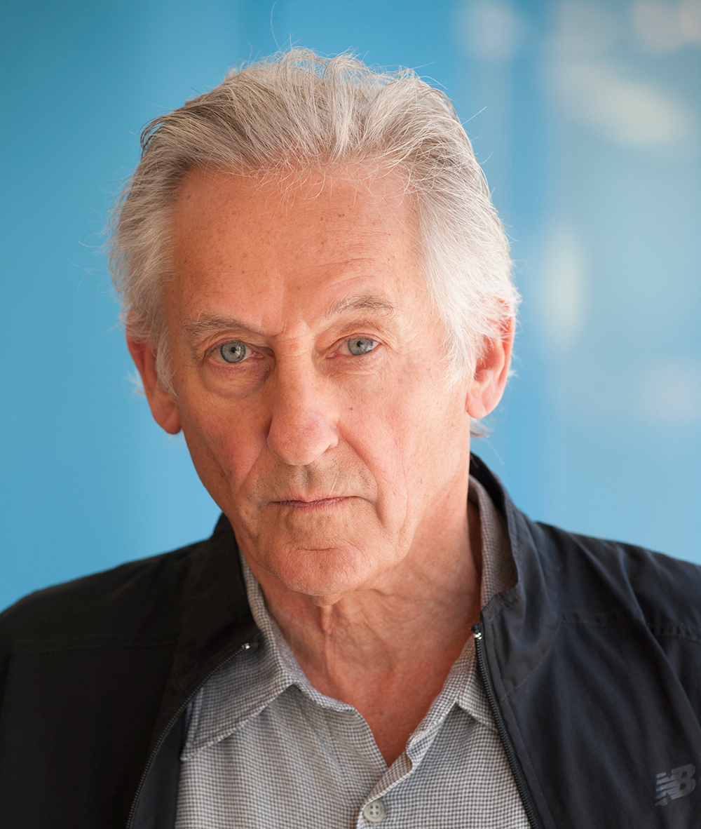 medium color portrait of Ed Ruscha wearing a button up shirt &amp;amp; jacket, looking directly to camera