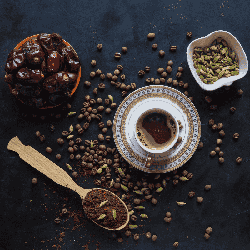 a cup of coffee and different kinds of beans