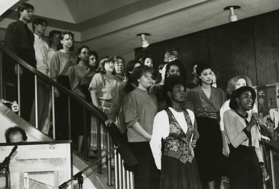 The Occidental Gospel Choir, with soloist Jacqui (Dent) Ivey '92 M'95 (foreground), performs in January 1991.