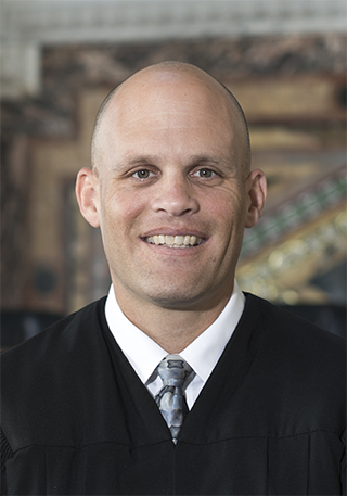 Judge John B. Owens headshot in court