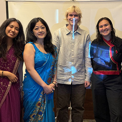 Oxy professor Vivian Lin with three of her students posing in Nepal