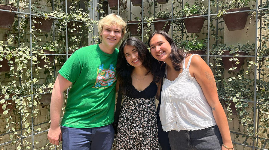 a group of three Occidental College students poses in Nepal