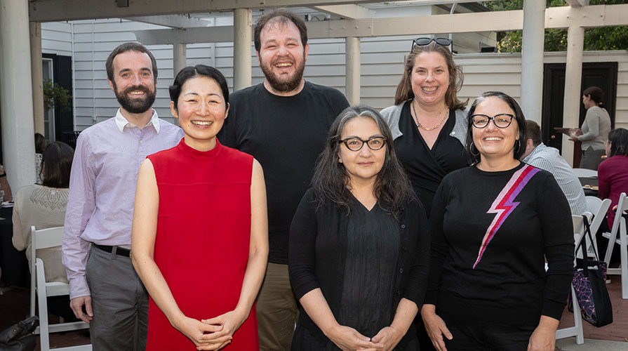 A group of 6 Occidental College faculty pose together with their teaching and mentorship awards