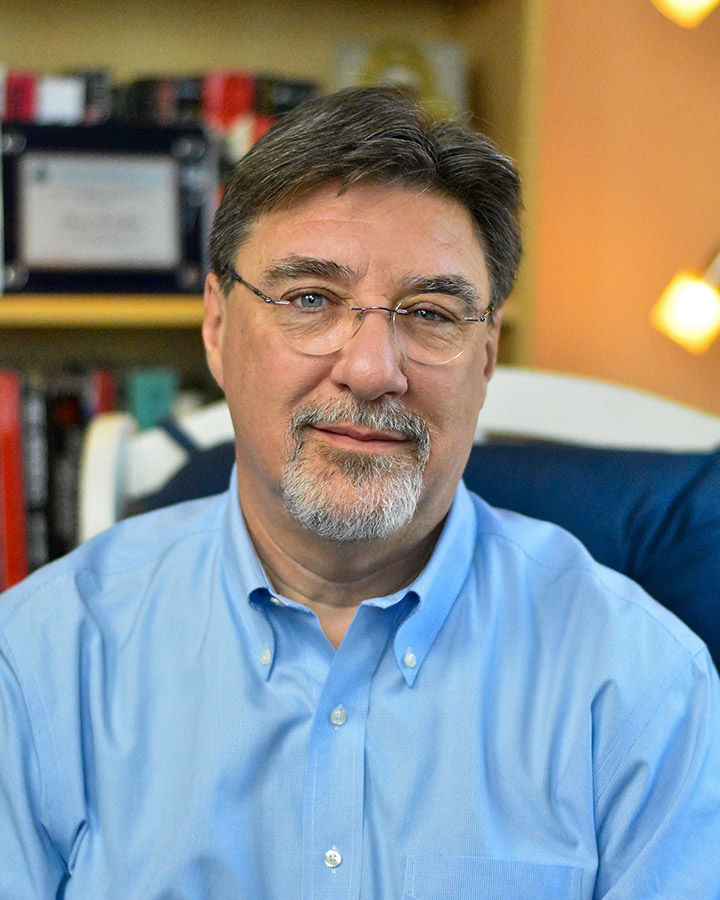 Tom Nichols headshot, blue button down shirt