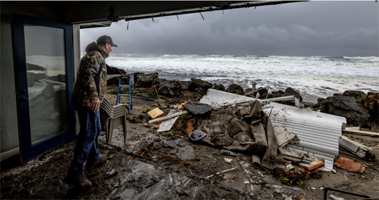 Ocean swells knocked out the front wall of Eric Stark’s oceanfront home in Rio Del Mar on January 5. Photo by Kevin Painchaud