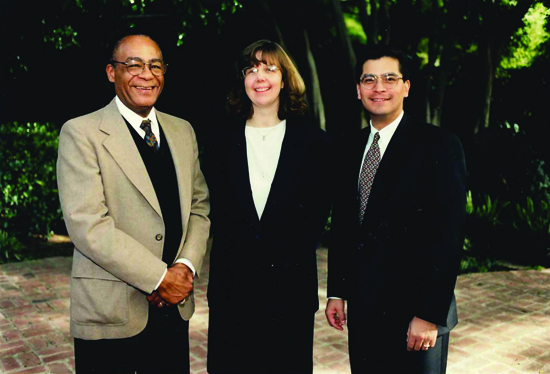 President John Brooks Slaughter, left, and then- Rep. Xavier Becerra (now Secretary of Health and Human Services) honored Spain as recipient of the NSF’s Presidential Early Career Award at a ceremony on campus in November 1997.