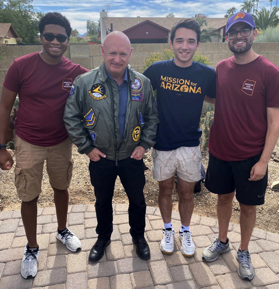 Senator Mark Kelly (D-AZ), second from left, with Noah Sullivan ’24, second from right, and his Mission for Arizona colleagues in 2022.