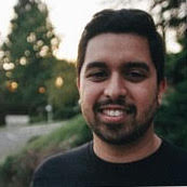 Man in front of trees