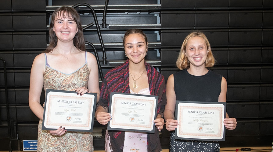 Three Occidental College students with their Senior Class Day Awards