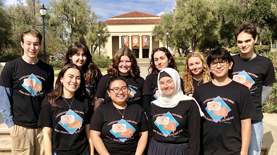 Group of students wearing Language to the Mind t-shirts