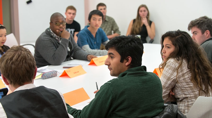 students sitting together around a table