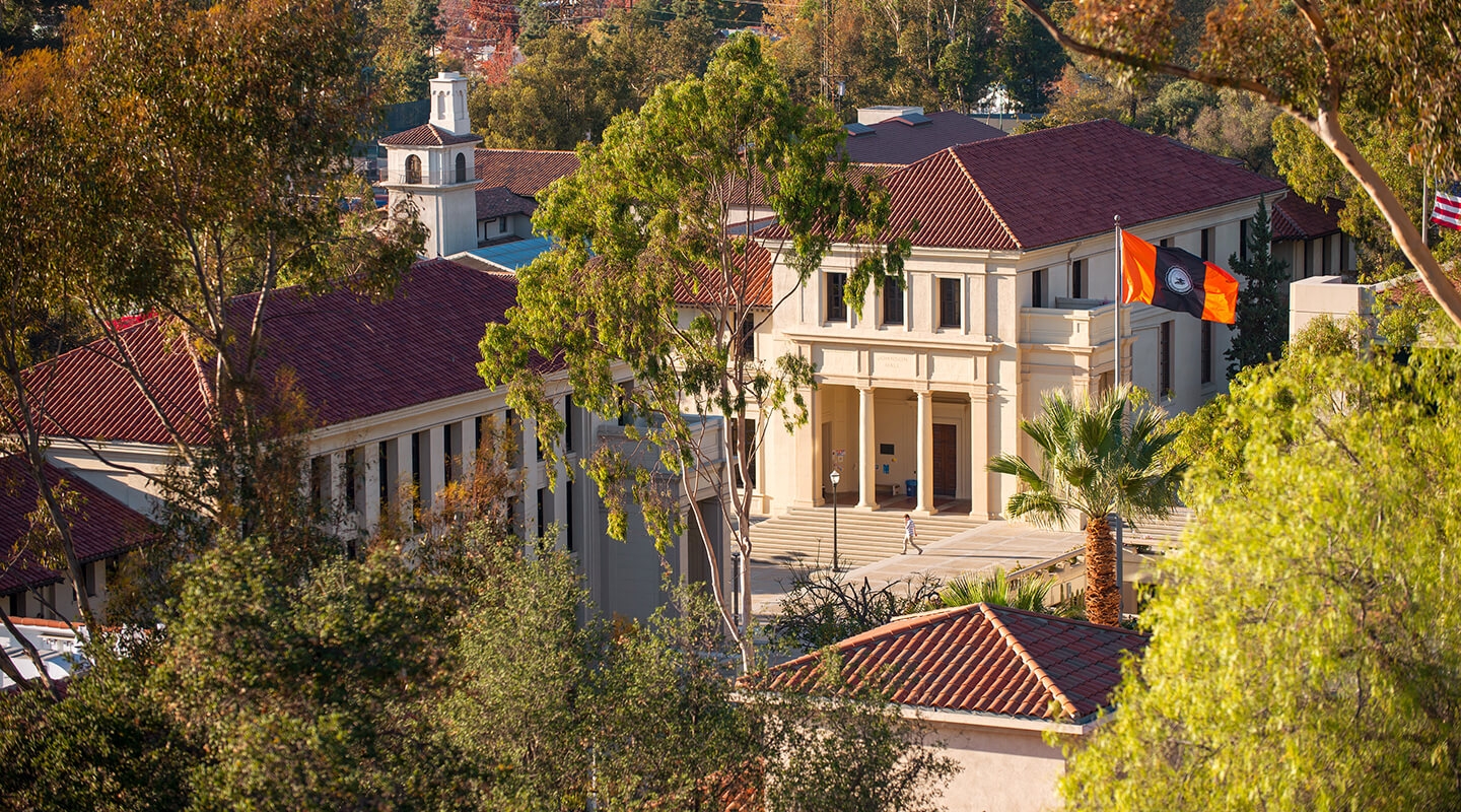 View of Johnson Hall, the Johnson Student Center bell tower and the Occidental College flag. 