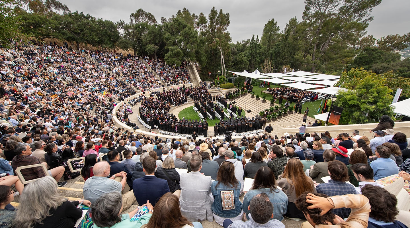 A panorama view of Remsen Bird Hillside Theater at Occidental College full of people on Commencement Day 2024