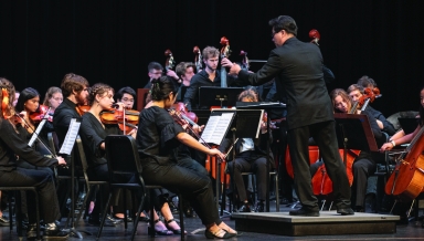 Chris Kim, the Choi Family Director of Instrumental Music, conducts the Occidental Symphony in a performance of Michael Jackson’s “Human Nature.”