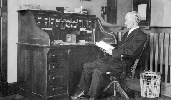 Professor William D. Ward at his desk in the Hall of Letters on Occidental’s Highland Park campus.