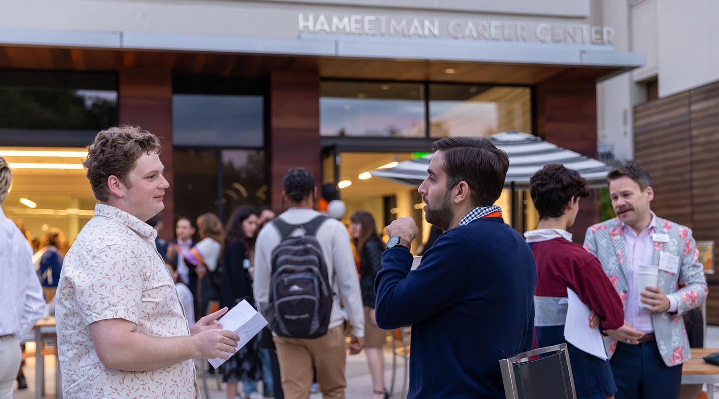 Occidental College students and alumni networking at an event in front of the Hameetman Career Center on campus