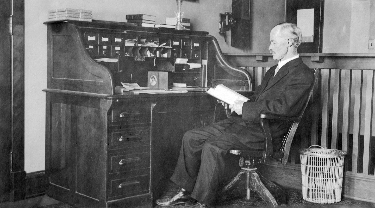 Professor William D. Ward at his desk in the Hall of Letters on Occidental’s Highland Park campus.