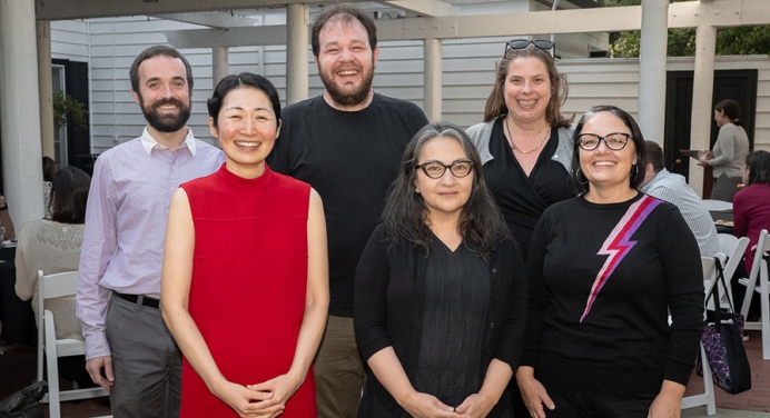 A group of 6 Occidental College faculty pose together with their teaching and mentorship awards