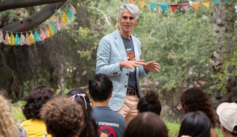 Occidental College president Tom Stritikus talks to students on campus at Matriculation