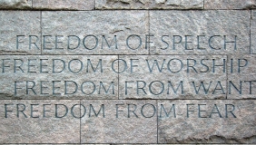 Text engraved on stone blocks reading: "Freedom of Speech / Freedom of Worship / Freedom from want / Freedom from fear"