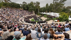 A panorama view of Remsen Bird Hillside Theater at Occidental College full of people on Commencement Day 2024