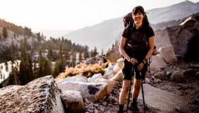 Dr. Joan Dudney in front of mountains and trees