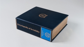 Photo of a blue leather bound book on a light grey background.