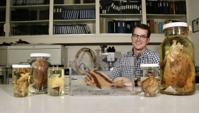 Photo of Dr. Bill Ludt with fish specimens