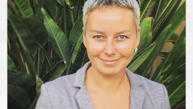 Dr. Katie Zyuzin in front of plants