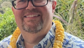 Dr. Spencer Nyholm in front of trees