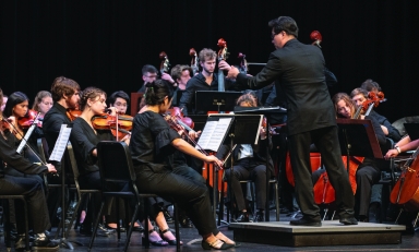 Chris Kim, the Choi Family Director of Instrumental Music, conducts the Occidental Symphony in a performance of Michael Jackson’s “Human Nature.”