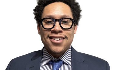 Man with tie in front of white background