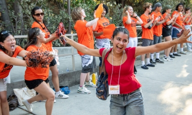 O-Team member cheer on new students as they walk into Remsen Bird Hillside Theater