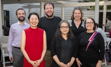 A group of 6 Occidental College faculty pose together with their teaching and mentorship awards