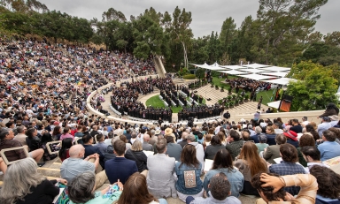 A panorama view of Remsen Bird Hillside Theater at Occidental College full of people on Commencement Day 2024