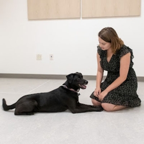 Eliza Nelson and a black dog