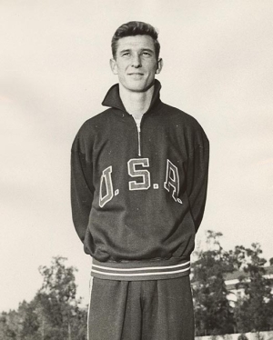 Olympian Bob Gutowski posing with his Team USA sweatshirt