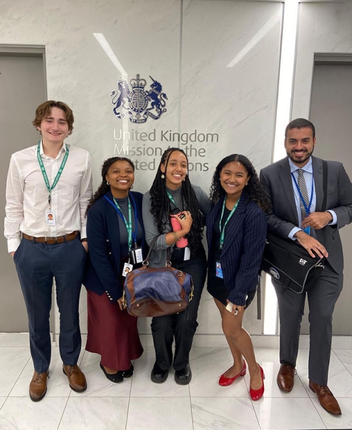 Five Occidental College students posing together at the UK Mission at UN headquarters in NYC